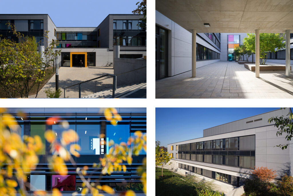 Moderner Architekturkomplex mit bunten Glasdetails und Innenhof.